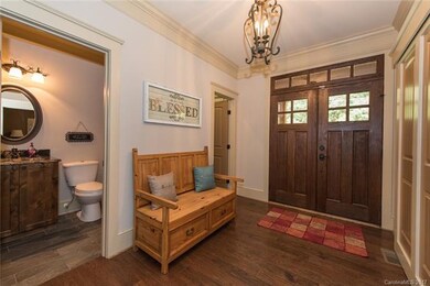 Double front doors lead you into the foyer.