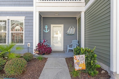 Doorway to property featuring a porch
