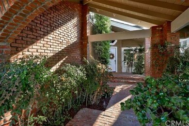 Enter the home under this lovely portico 