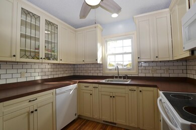 Trendy kitchen cabinets with subway tile.