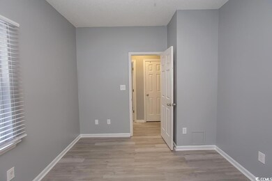 Unfurnished room featuring a textured ceiling and 