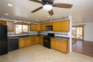 Beautiful kitchen with newer cabinets and glass ti