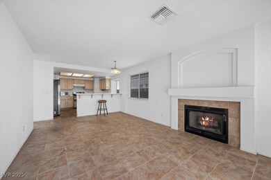 Family room featuring tile flooring and a gas fireplace