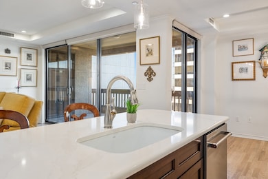 Updated finishes, large peninsula with sink and seating.