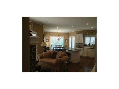 Hearth area with fireplace off kitchen