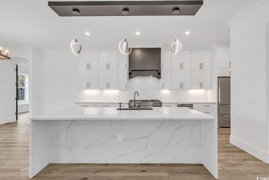 Kitchen with light hardwood / wood-style floors, s