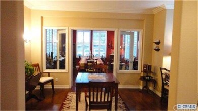 French doors lead to sunroom used as formal dining