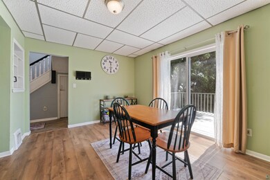 Dining area with hardwood / wood-style flooring an