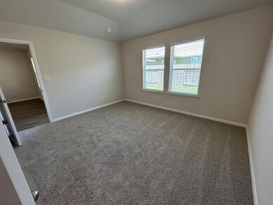Unfurnished room featuring carpet floors and vaulted ceiling