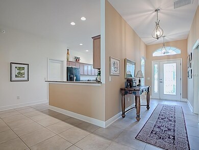 LOVELY LIGHTING AND HIGH CEILINGS LIGHT THE FOYER/