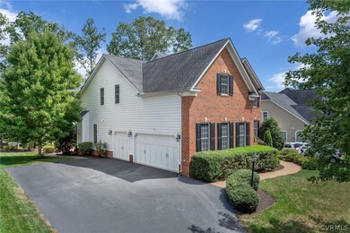 Extended driveway and three car garage.