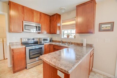 Kitchen has upgraded 42-inch cabinets and stainles