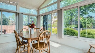 Beautiful Sunroom walks out to the gorgeous back y
