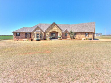 View of front of house featuring a front yard, bri