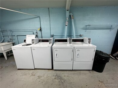 Shared laundry area featuring independent washer a