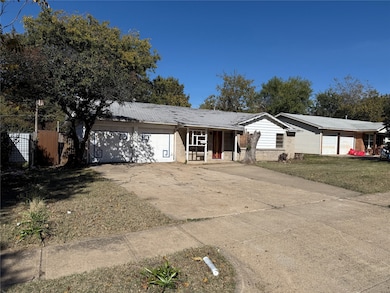 Single story home with concrete driveway and brick siding