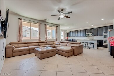 Living area with light tile patterned floors, ceil