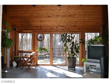 Other - This tiled sunroom with vaulted ceiling wi