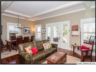 Hardwood floors and coffered ceilings throughout t