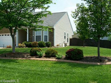 Exterior Front. Curbing added around landscaping
