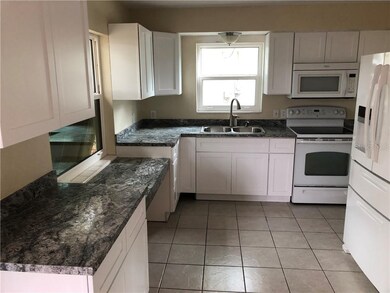 New Kitchen Cabinets and Counters.  Little bar for