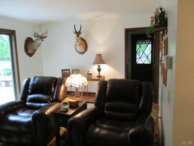 View of family room, patio doors to left lead out 