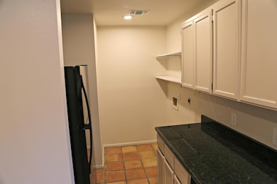 Laundry area with cabinet space, electric dryer h