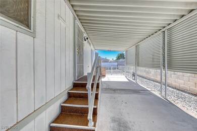 View of patio featuring fence