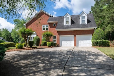 View of front of home with brick siding, concrete 
