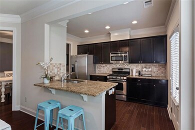 Stylish kitchen with stainless appliances, pantry and plenty of cabinet storage.