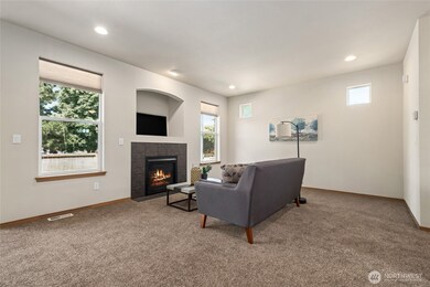 Spacious living rooms are centered around a cozy gas fireplace.