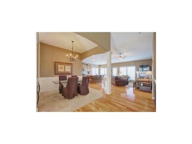 Welcoming entry opens to formal dining room, heart