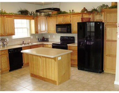 Kitchen. Lots of cabinets with lots of counter space in this Kitchen, Notice the pan rack above the island
