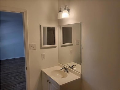 Bathroom featuring vanity and wood finished floors