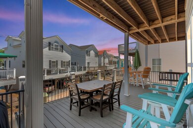 Deck featuring outdoor dining space and a residential view