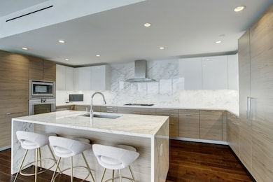 BEAUTIFUL KITCHEN WITH PLENTY OF STORAGE, SOFT CLOSING CABINETS AND DRAWERS AND UNDER COUNTER LIGHTING.