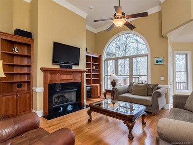 GREAT ROOM WITH HARDWOOD FLOORS AND BUILT IN CABIN