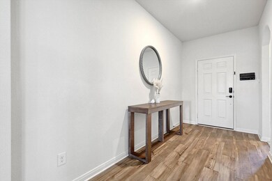 Foyer with wood-type flooring