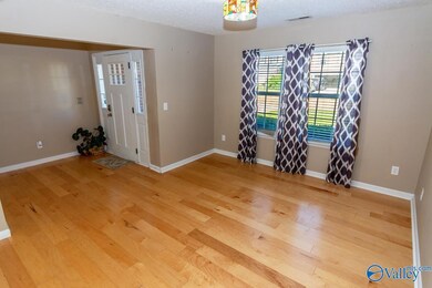 ENJOY THIS 12X11 LIVING ROOM OPEN TO DINING ROOM AND GREAT ROOM OVERLOOKING KITCHEN.