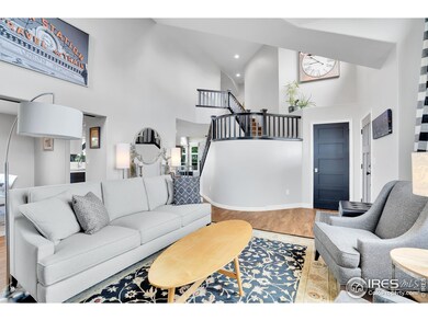 Stunning livingroom with high ceilings and natural light throughout.