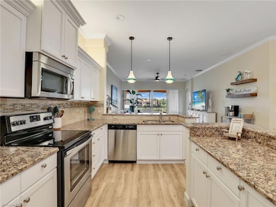 Kitchen with appliances with stainless steel finis