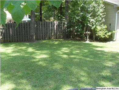 Manicured fenced in yard