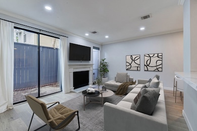 To the right, the inviting living room with ample