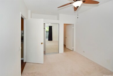 Bedroom 1 w/ ceiling fan & window AC