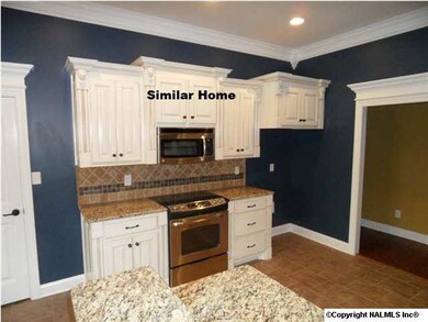 Family room with 10 foot ceiling, wood floor, recessed lighting, ceiling fan, gas logs in fireplace.