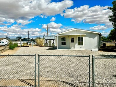 View of home, structures, and large lot.