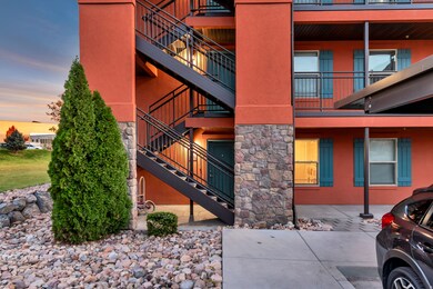 Property at dusk with a view of apartment building / complex