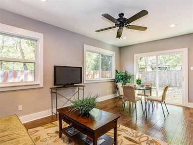 Living area with healthy amount of natural light, light wood-style floors, recessed lighting, and ceiling fan