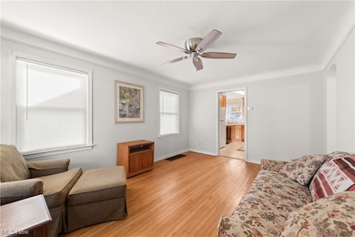 Natural hardwood flooring and newer windows and ceiling fan!
