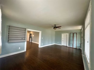 Spare room with dark hardwood / wood-style floors